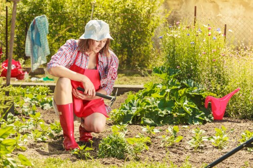 Serviceman checking garden machinery for safety and maintenance